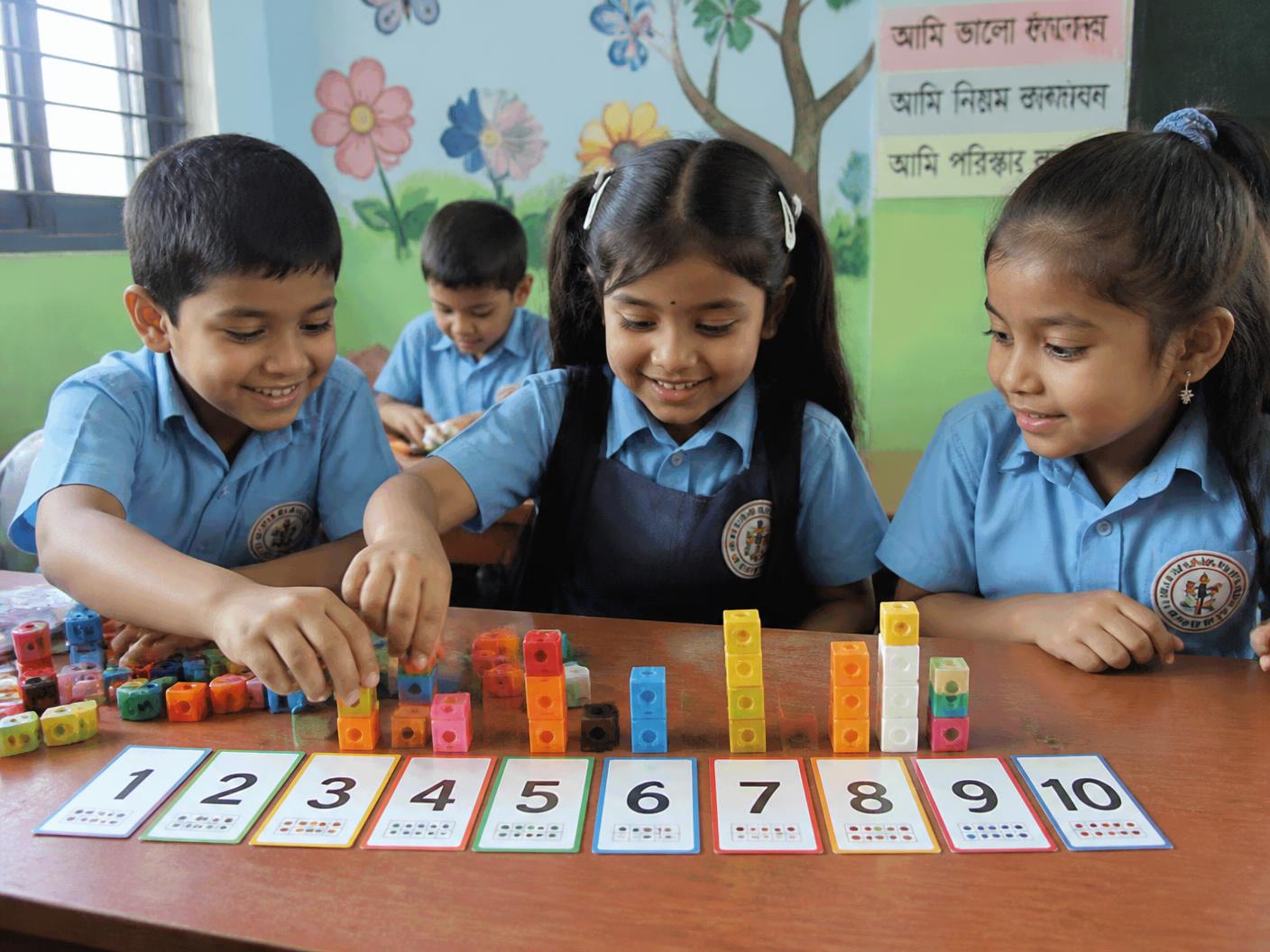 Young students working together on a counting activity in class